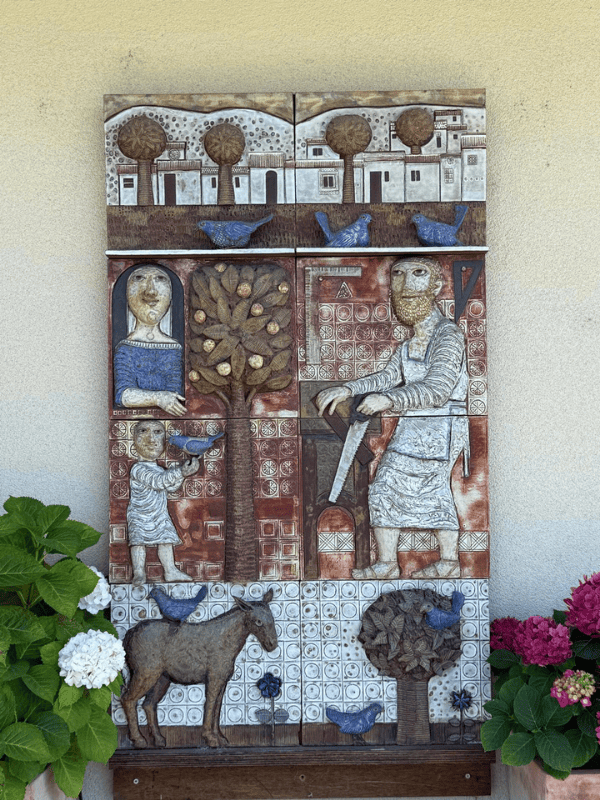 Mosaic mural with biblical scenes on the parish exterior