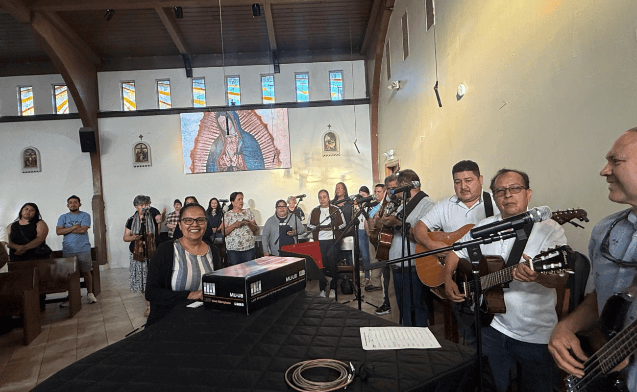 Musicians playing guitar during a youth ministry gathering