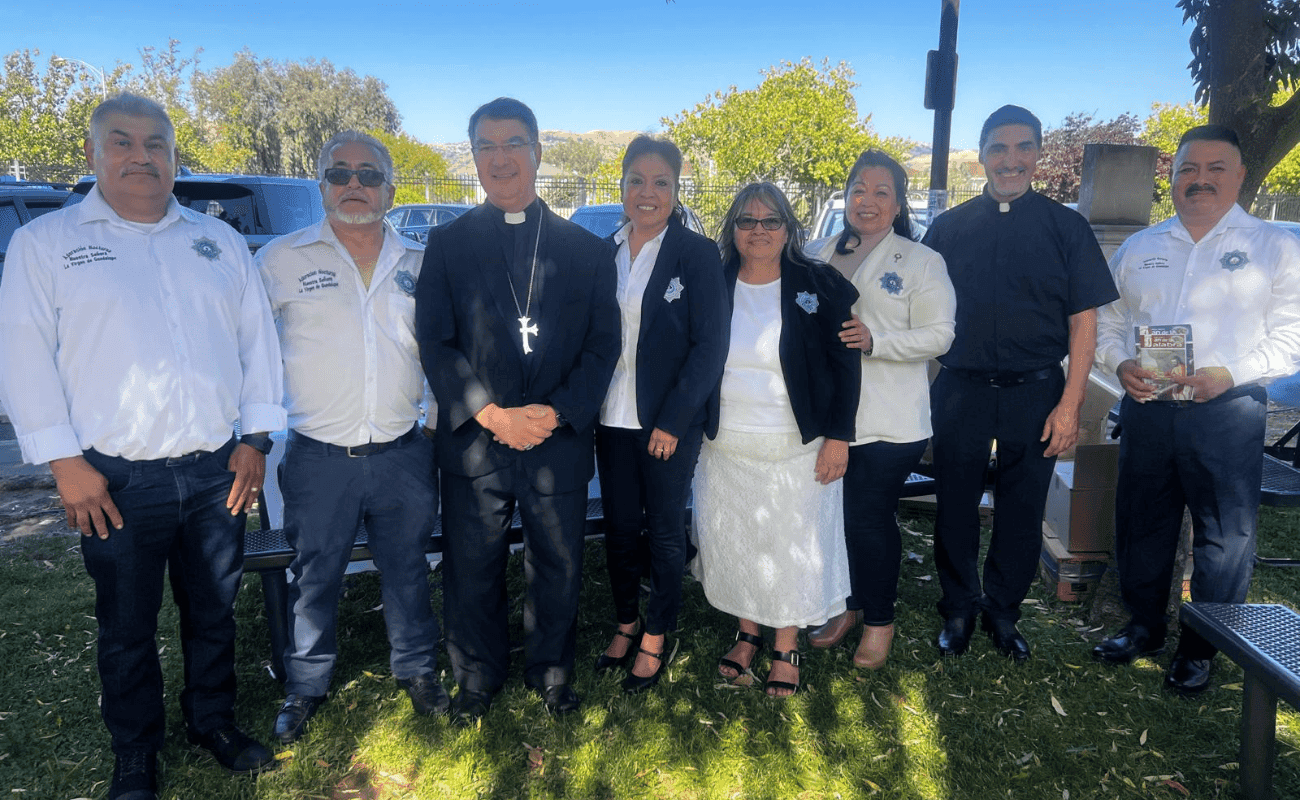 Ministry members with priests outdoors