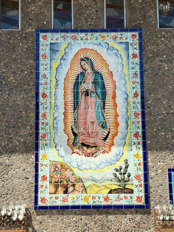 Tile mural of Our Lady of Guadalupe on the exterior wall