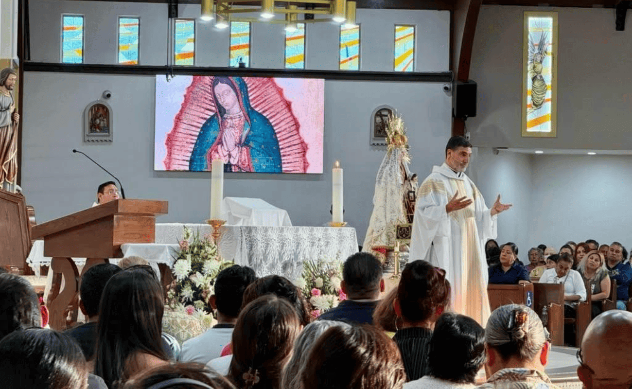 Priest celebrating before the image of Our Lady of Guadalupe during the patronal feast