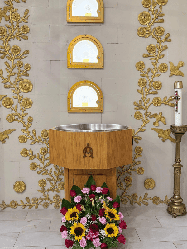 Baptismal font with flowers and gilded decoration
