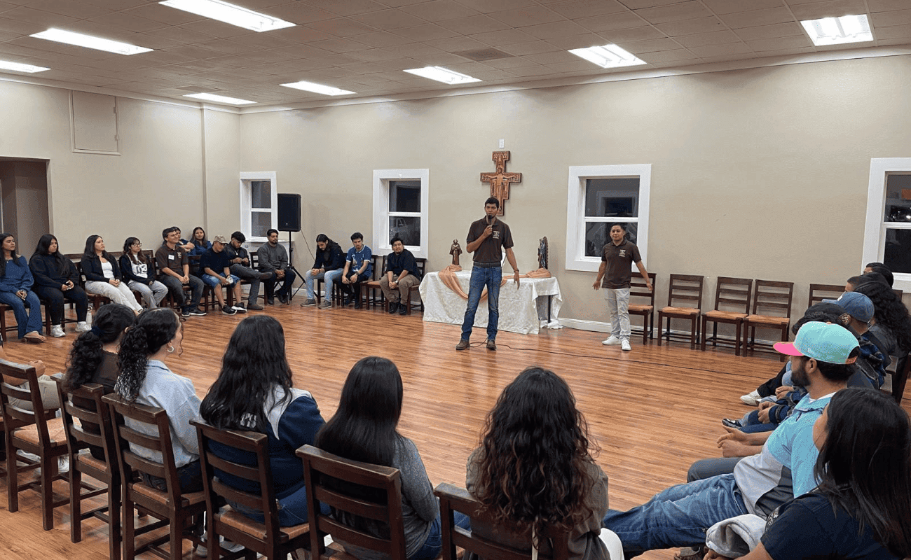 Young people listening to a talk in the parish hall