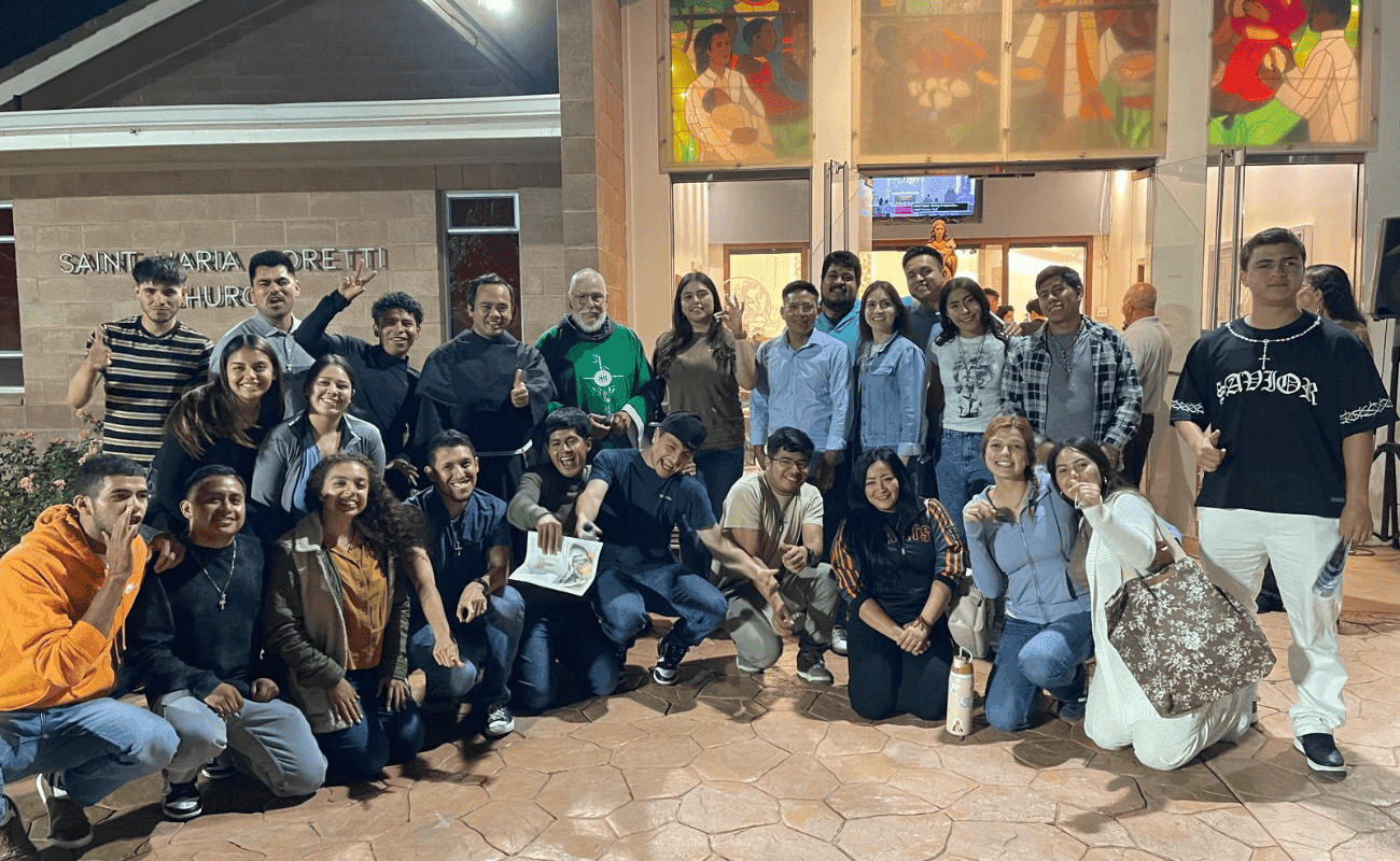 Group photo of young people outdoors at night